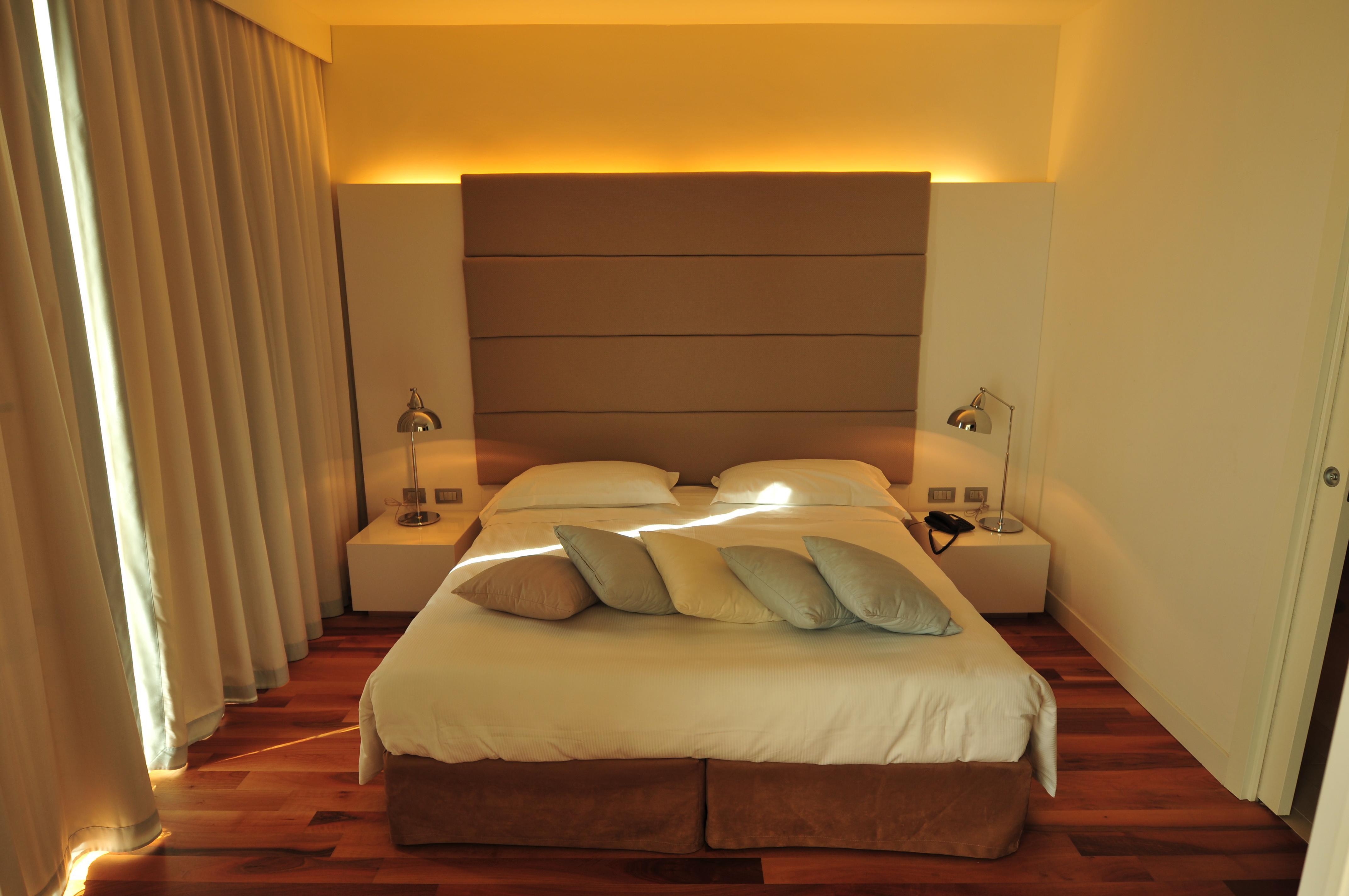 Pisa Tower Plaza Hotel Exterior foto A bedroom